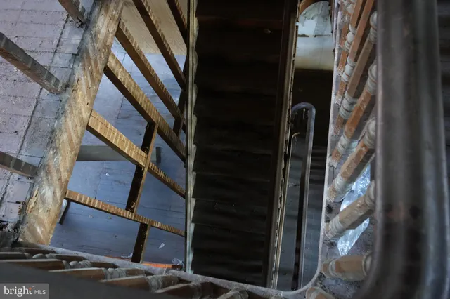 a view of staircase with wooden floor and stairs