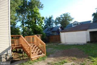 2904 Allendale Road Baltimore, MD 21216 - Photo 24 of 30 a view of backyard with barbeque grill and wooden fence