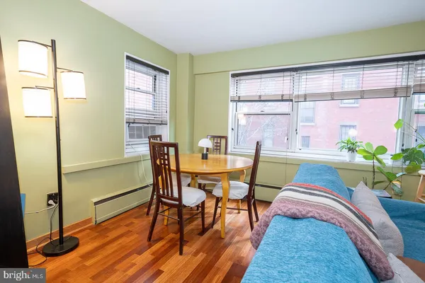 a view of a dining room with furniture and a window