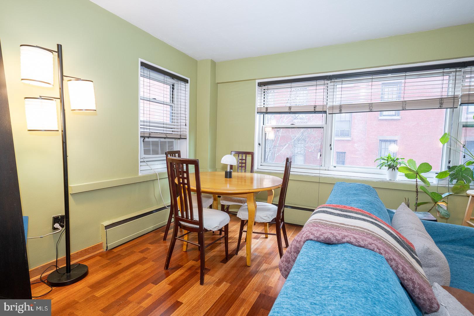 118 South 21st Street, Unit 210 Philadelphia, PA 19103 - Photo 4 of 21 a view of a dining room with furniture and a window