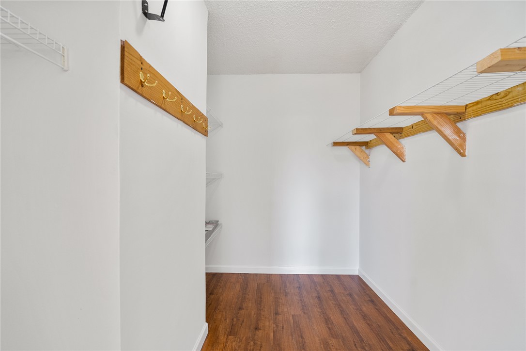 2305 Millgate Road Anderson, SC 29621 - Photo 11 of 18 Functional walk-in closet offers ample storage with durable shelving and hanging solutions.