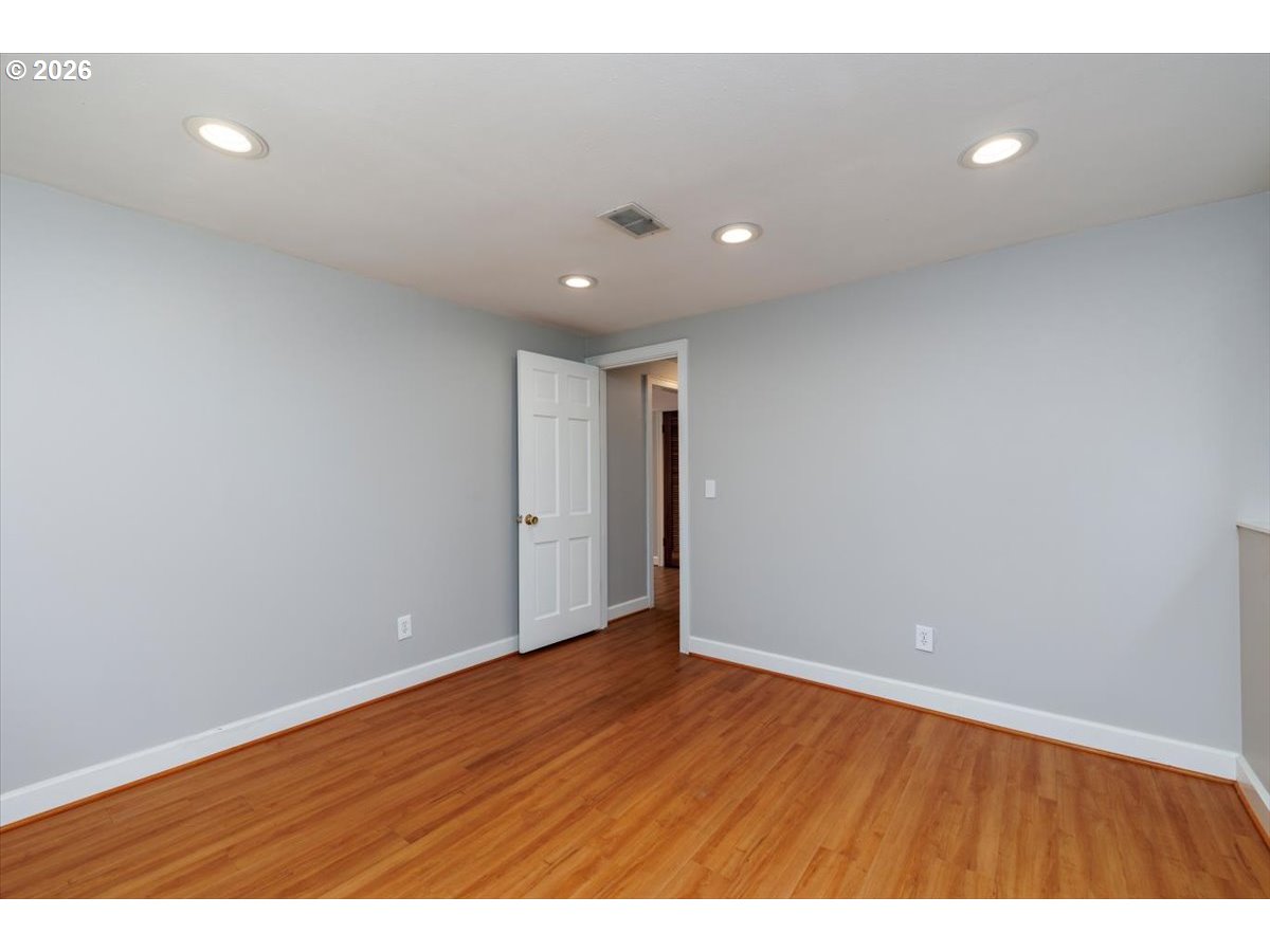175 Northwest 95th Avenue Portland, OR 97229 - Photo 27 of 46 a view of an empty room with wooden floor