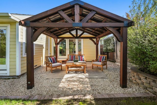 an aerial view of a house with a yard