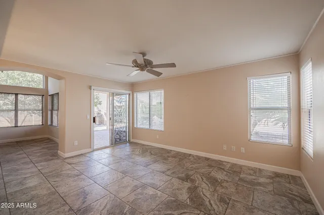 a view of a kitchen with a sink and a refrigerator