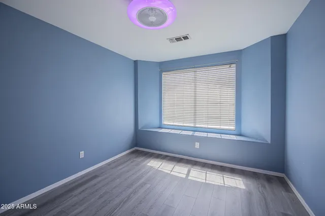 wooden floor in a hall with an entryway