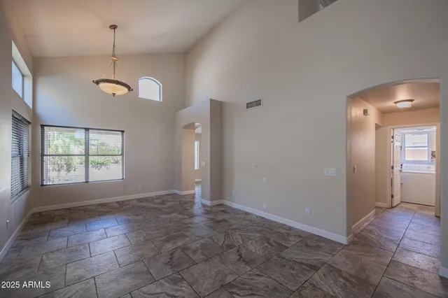 a kitchen with stainless steel appliances granite countertop a stove cabinets and a sink
