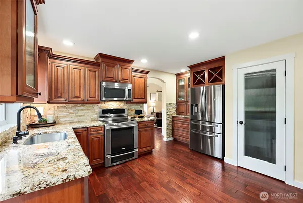 a living room with furniture fireplace and window