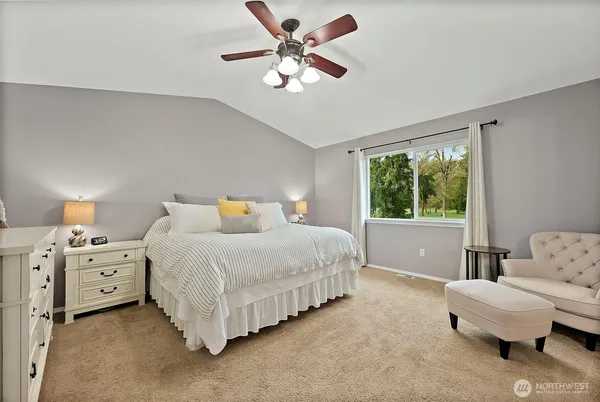 a bedroom with a bed and furniture