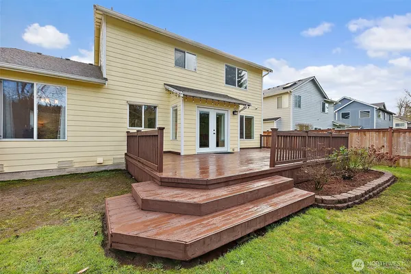 a view of a house with a backyard patio and swimming pool