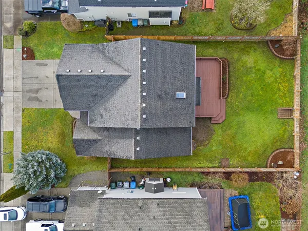 an aerial view of a house with swimming pool and outdoor space