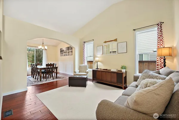 a living room with furniture and a lamp