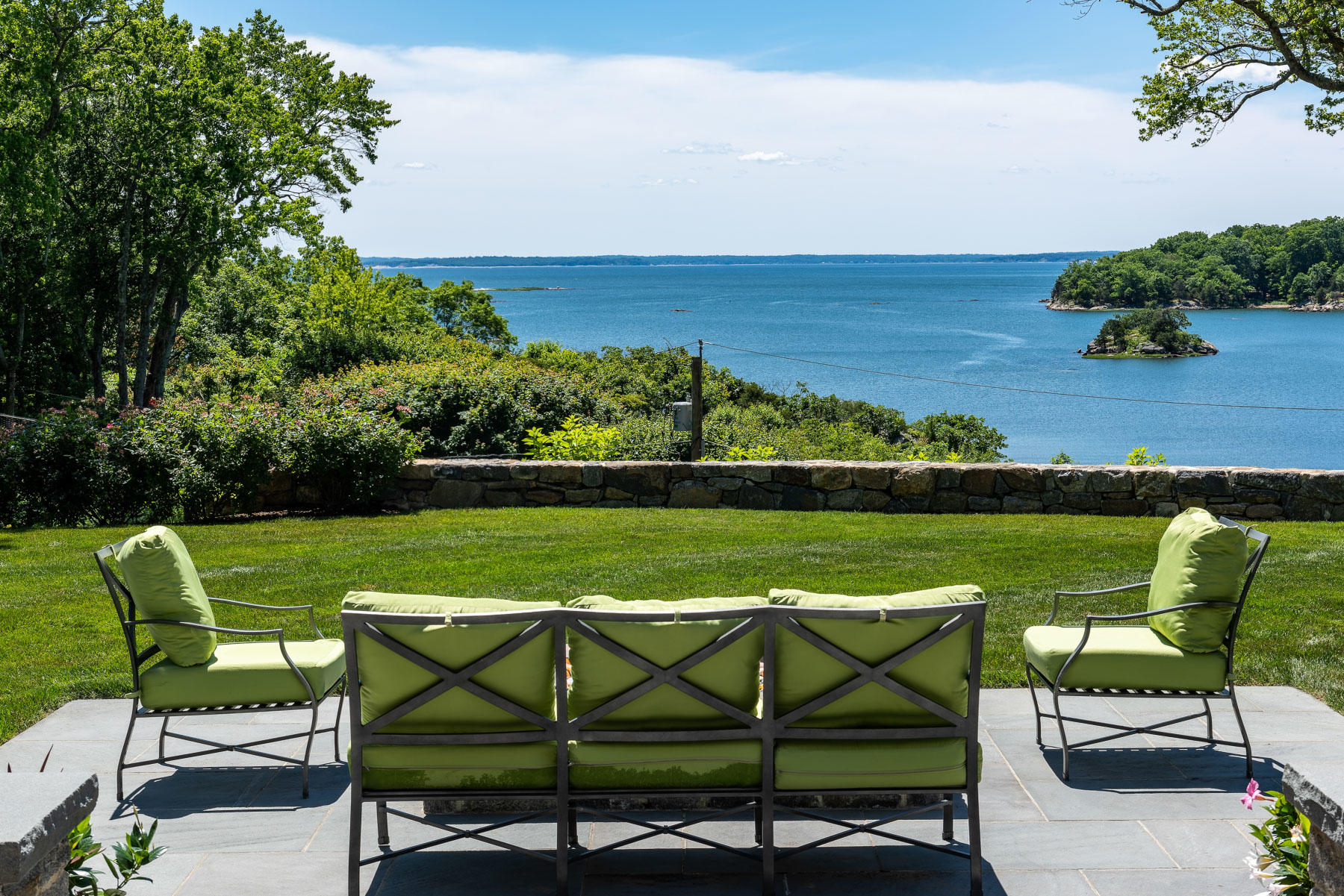 16 Raiders Lane Darien, CT 06820 - Photo 12 of 53 a view of a swimming pool and lounge chairs