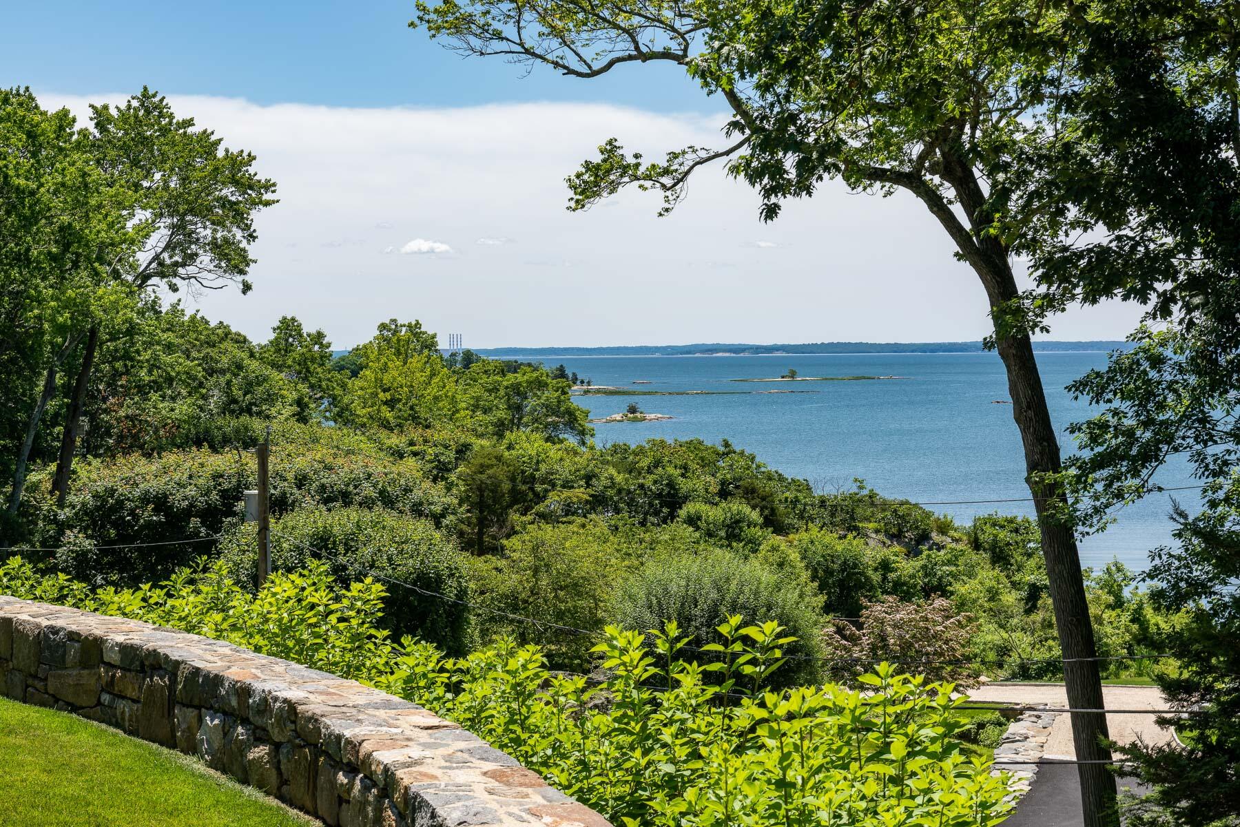 16 Raiders Lane Darien, CT 06820 - Photo 20 of 53 an aerial view of a house with a garden