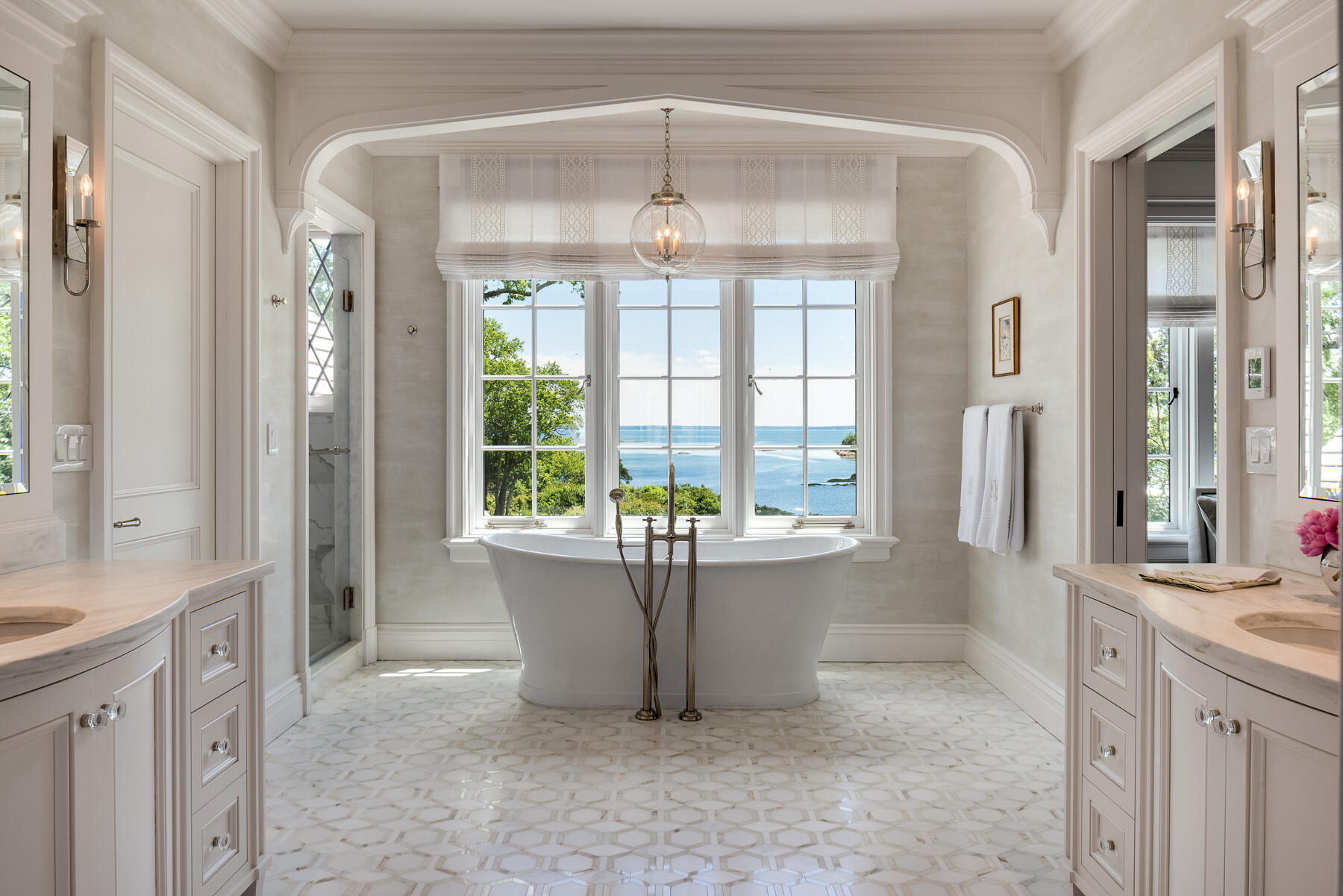 16 Raiders Lane Darien, CT 06820 - Photo 24 of 53 a living room with a large window and chandelier