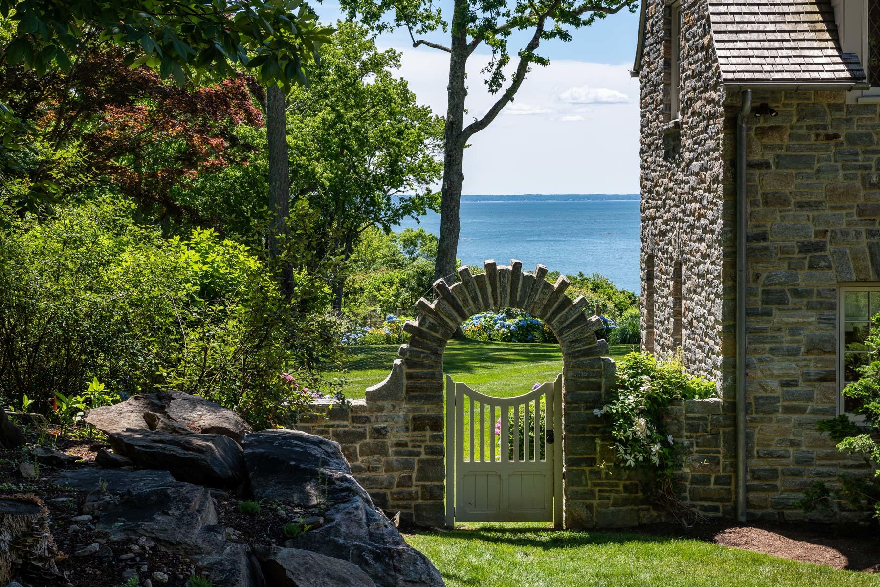 16 Raiders Lane Darien, CT 06820 - Photo 4 of 53 a front view of a house with a yard