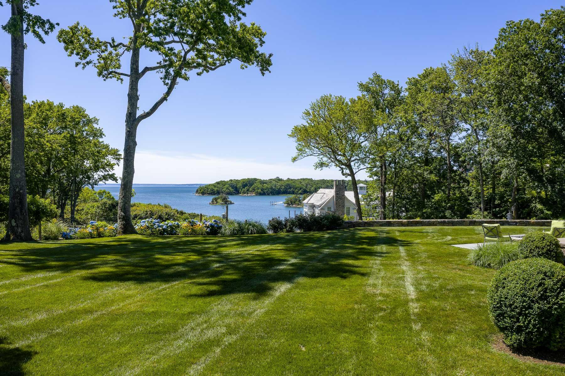 16 Raiders Lane Darien, CT 06820 - Photo 32 of 53 a view of a grassy field with an trees