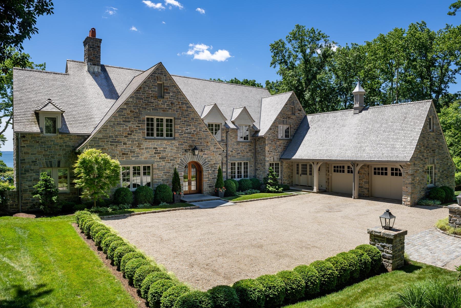 16 Raiders Lane Darien, CT 06820 - Photo 49 of 53 a front view of a house with a yard