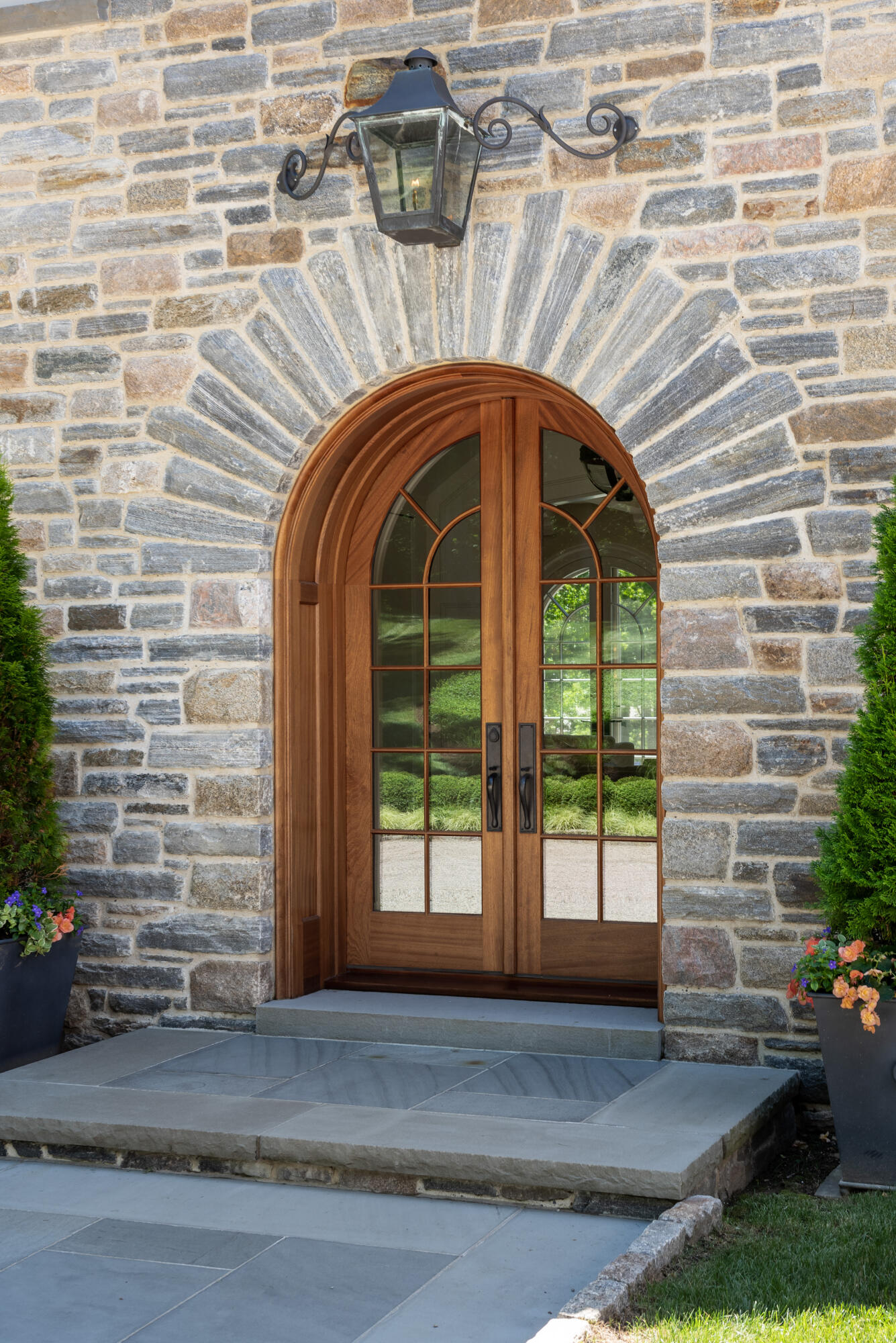 16 Raiders Lane Darien, CT 06820 - Photo 6 of 53 a front view of a house with a garage