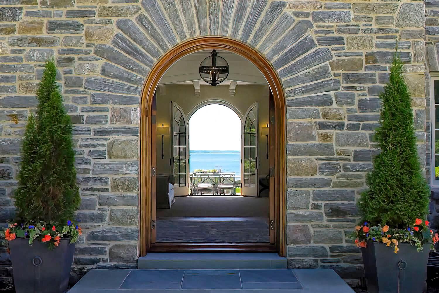 16 Raiders Lane Darien, CT 06820 - Photo 7 of 53 a front view of a house with a garden