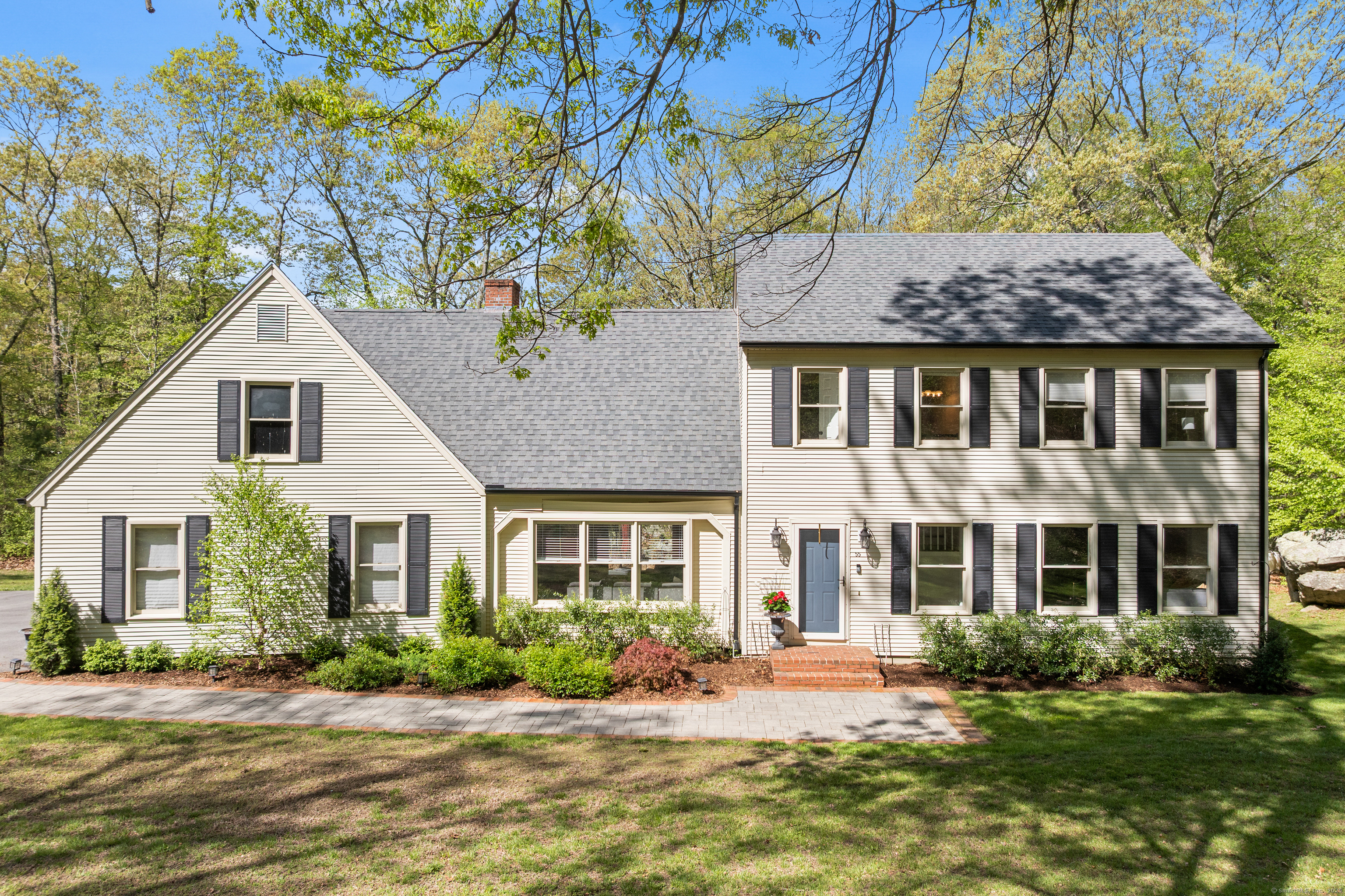 front view of a house with a yard