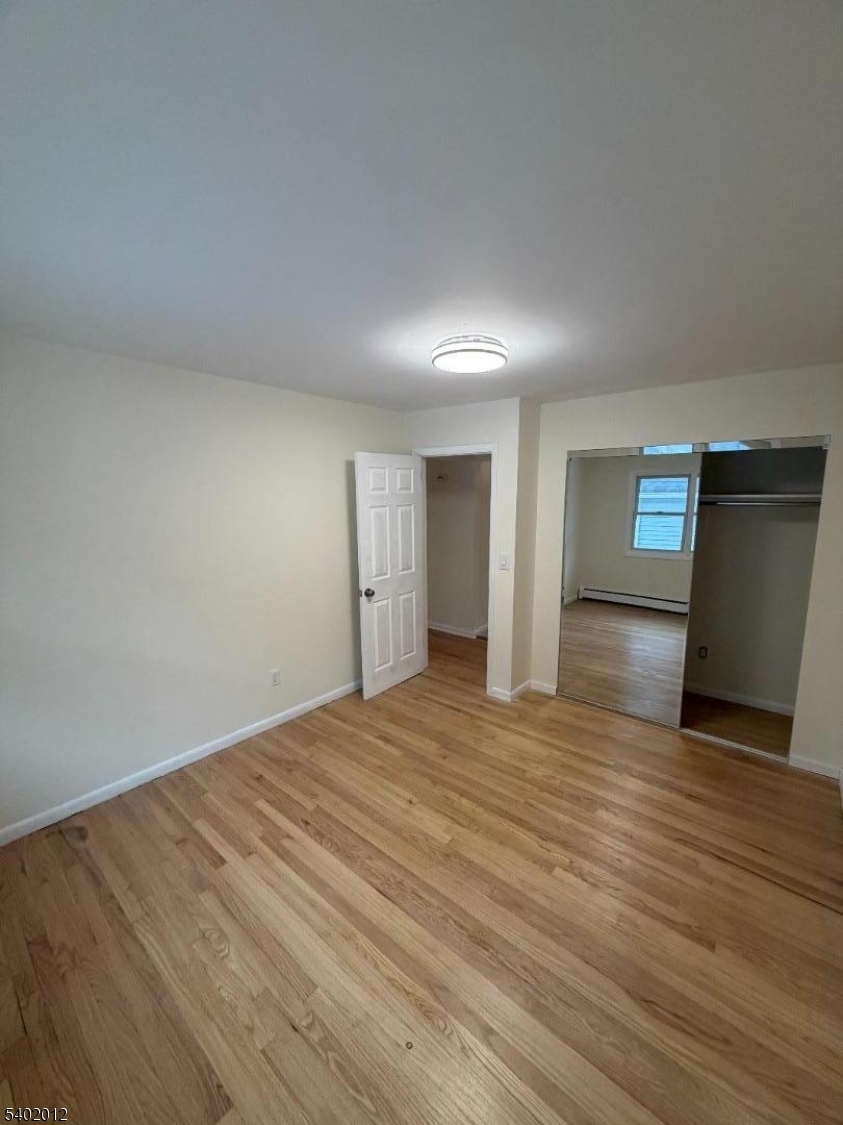360 Highland Avenue, Unit 2 Passaic, NJ 07055 - Photo 11 of 23 a view of empty room with wooden floor