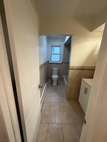 a view of a bathroom with a toilet