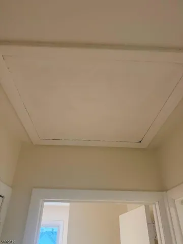 a view of walk in closet with wooden floor