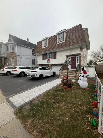 a view of a cars park in front of a building