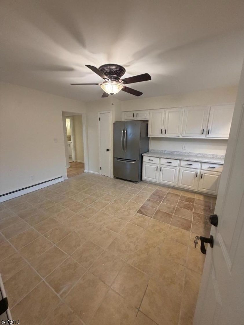 360 Highland Avenue, Unit 2 Passaic, NJ 07055 - Photo 5 of 23 a view of a kitchen with a sink and cabinets