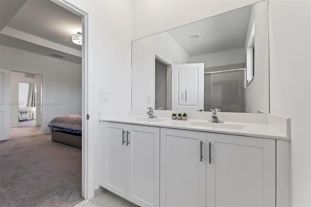 a bedroom with a bed and a cabinets