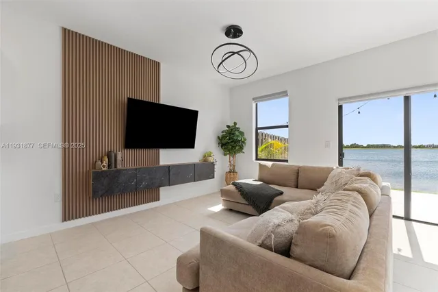 a living room with furniture and a window