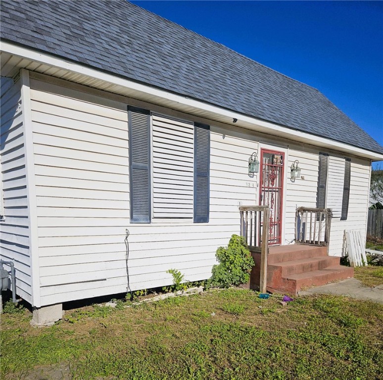 3218 McArdle Road Corpus Christi, TX 78415 - Photo 2 of 32 a front view of a house with a yard