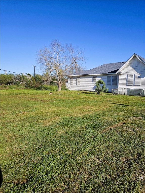 3218 McArdle Road Corpus Christi, TX 78415 - Photo 4 of 32 a view of a big yard with a house in the background