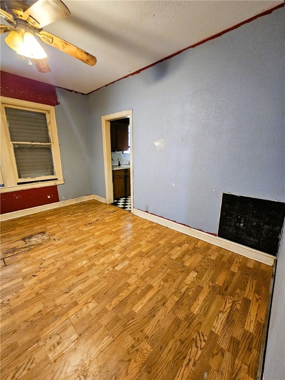 3218 McArdle Road Corpus Christi, TX 78415 - Photo 8 of 32 a view of an empty room with a fireplace and a window