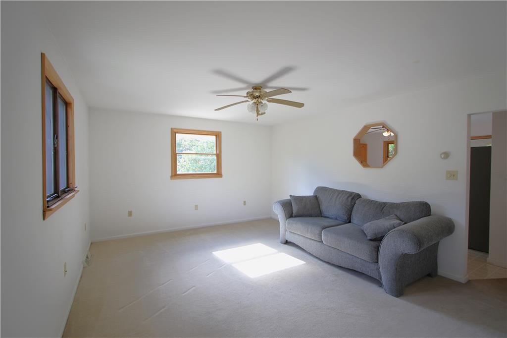 796 Rte 481 Monongahela, PA 15063 - Photo 5 of 26 Large 16x13 Living Room w/ Ceiling Fan Light, Door to Front Deck & Wood Trim Octagon opening into Kitchen