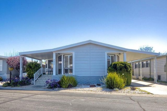 front view of a house with a small yard