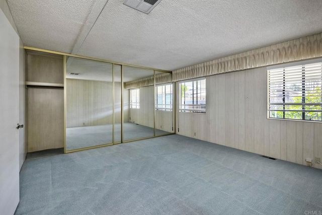 a spacious bathroom with a bathtub toilet and sink