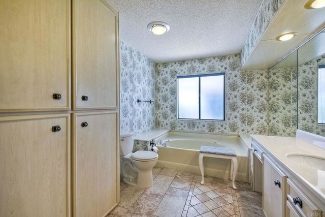 an aerial view of residential houses with outdoor space and street view