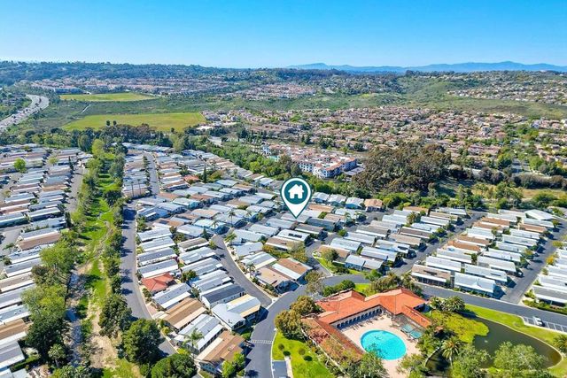 a view of a golf course with a lake view