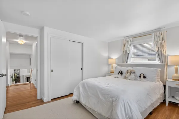 a bedroom with a bed and window