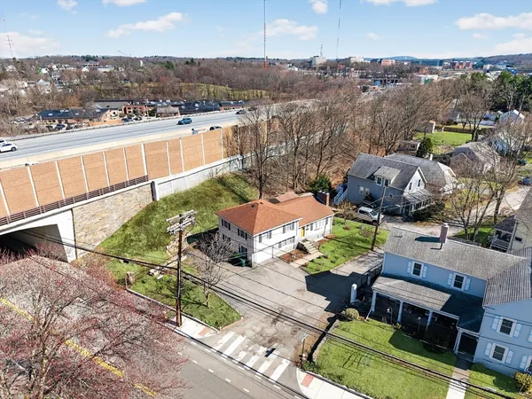 an aerial view of multiple houses with yard