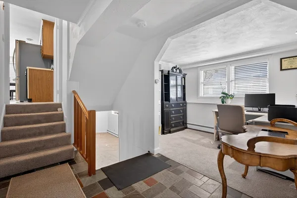 a workspace with furniture and stairs