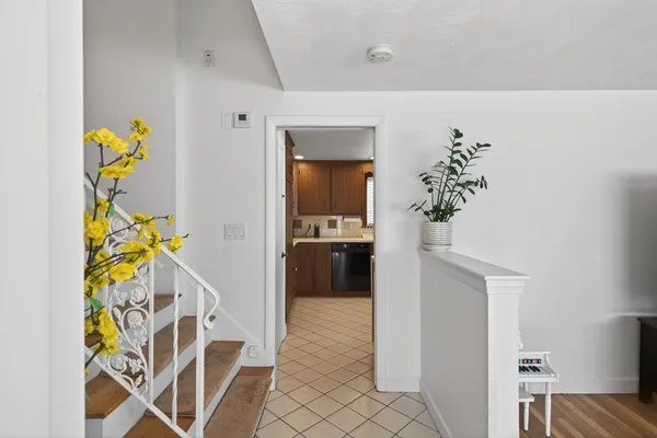 a view of an entryway and wooden floor