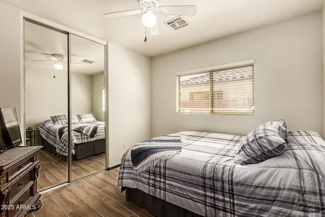 a bedroom with a bed and a table