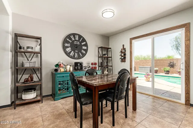 a view of a dining room and livingroom with furniture