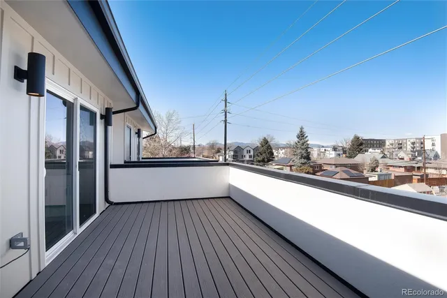 a view of a balcony with city view