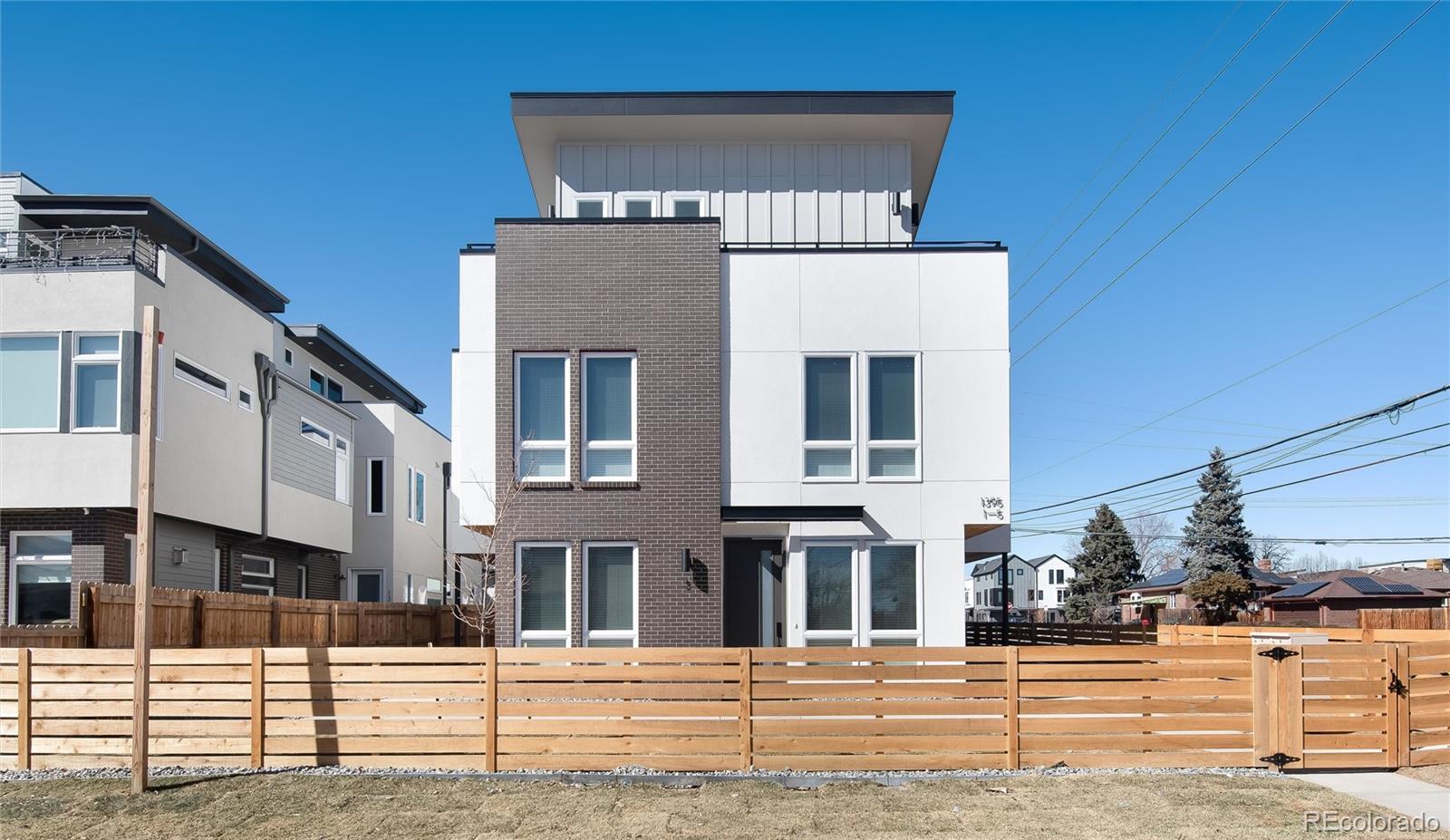 1395 Xavier Street, Unit 2 Denver, CO 80204 - Photo 5 of 14 a front view of a building with street