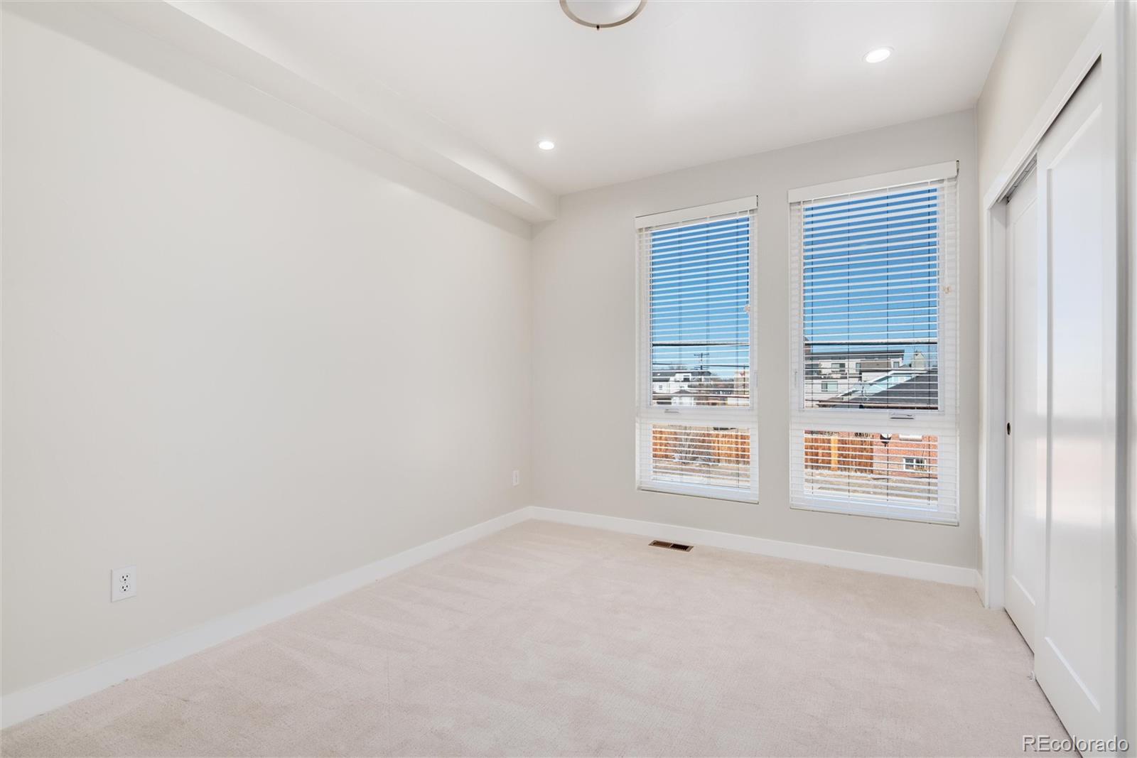 1395 Xavier Street, Unit 2 Denver, CO 80204 - Photo 6 of 14 an empty room with a window