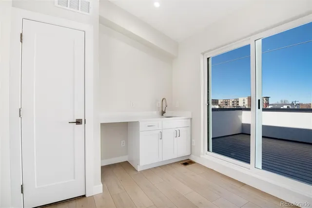 a spacious bathroom with a double vanity sink and a mirror