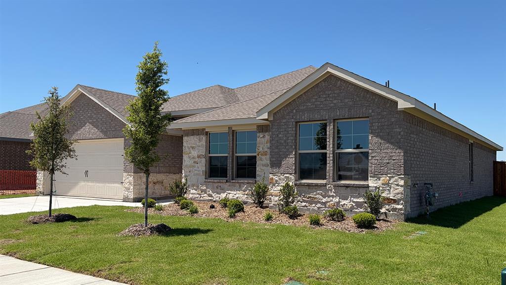 2007 Reveille Way Terrell, TX 75160 - Photo 3 of 31 a front view of house with a garden and patio